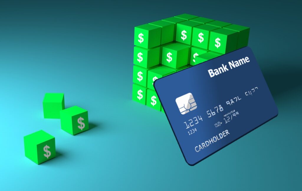 A credit card and stacks of blocks to symbolize building credit